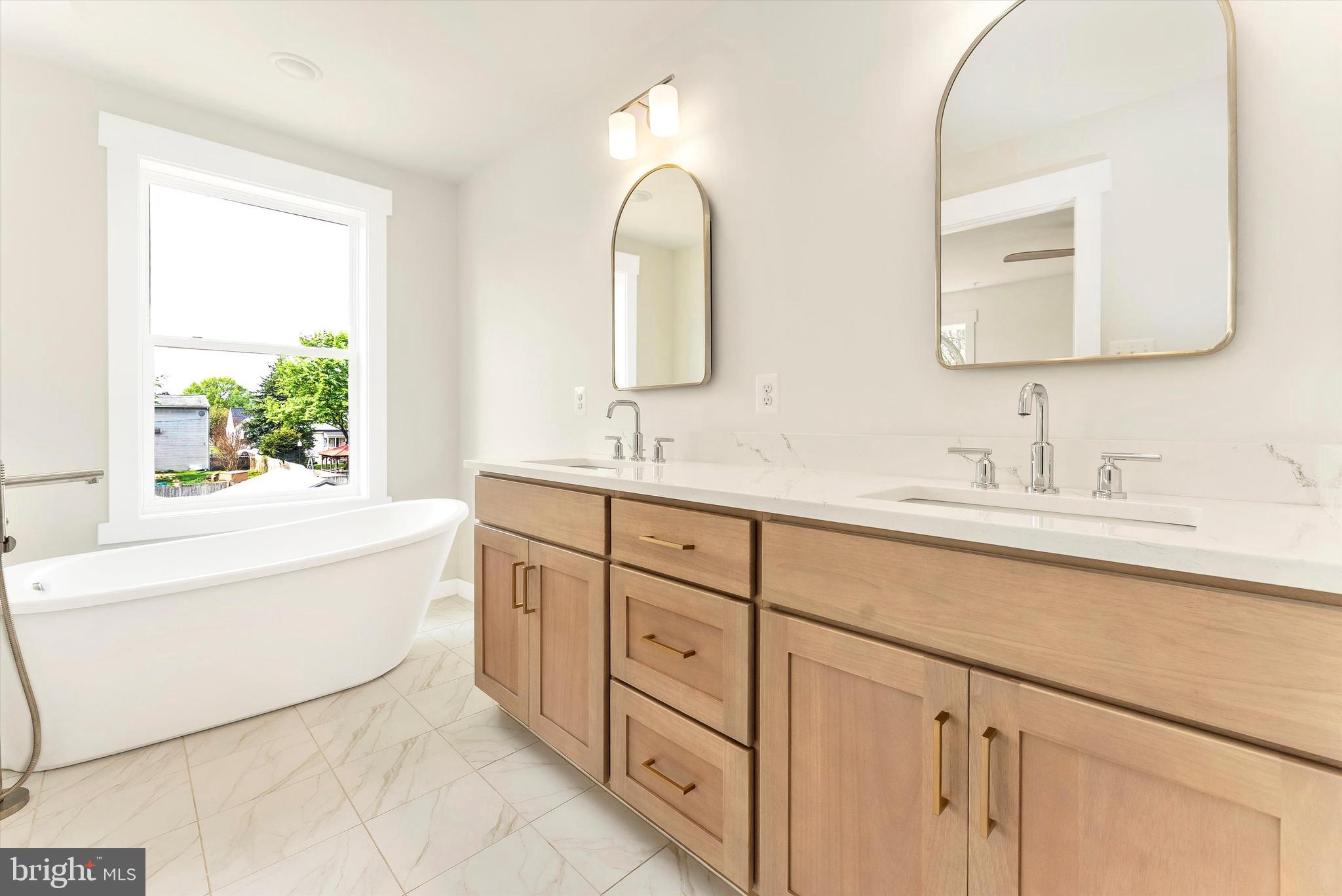 328 Madison Street Frederick, MD 21701 - Photo 28 of 49 a bathroom with a double vanity sink mirror and a