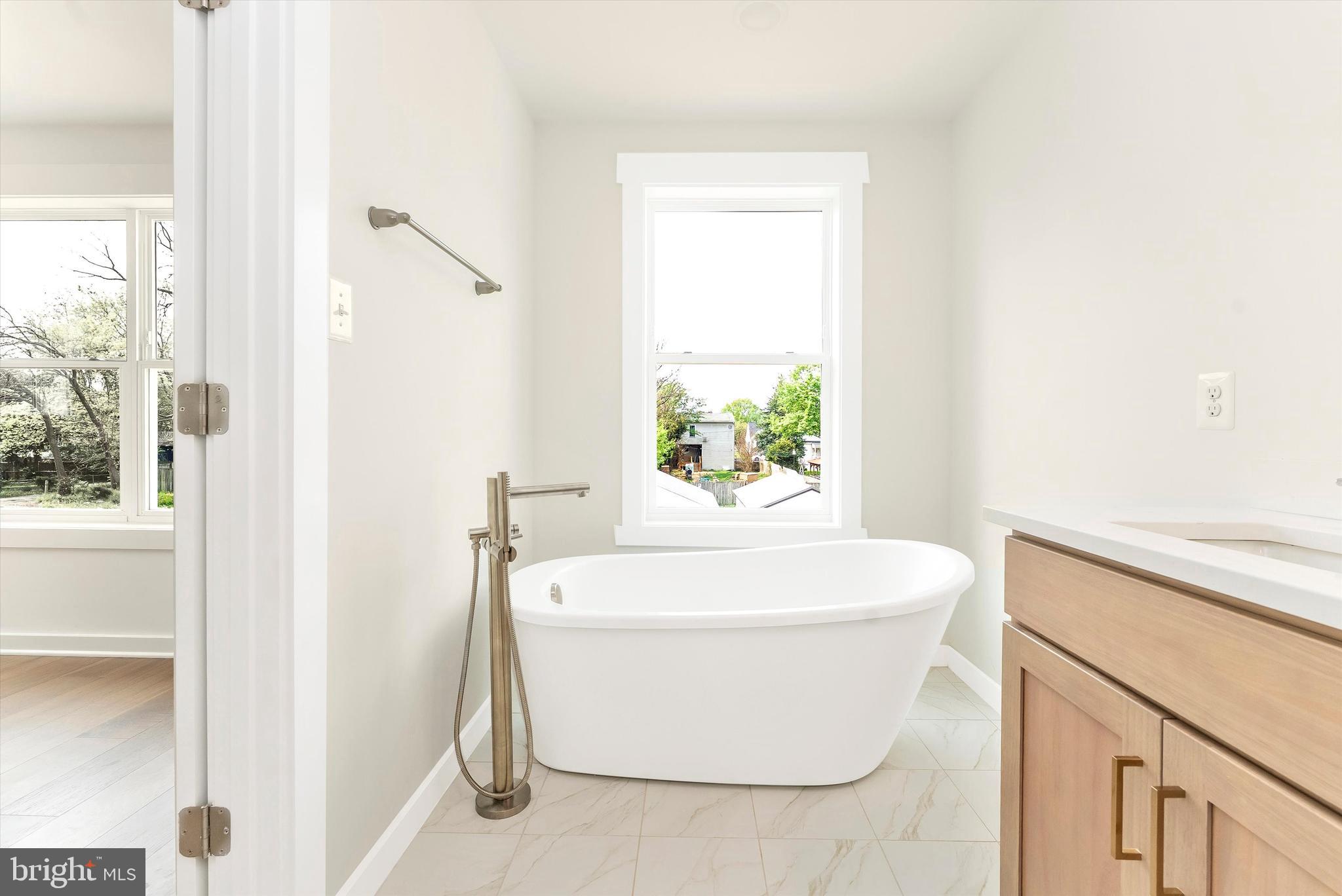 328 Madison Street Frederick, MD 21701 - Photo 29 of 49 a white bath tub sitting next to a white sink