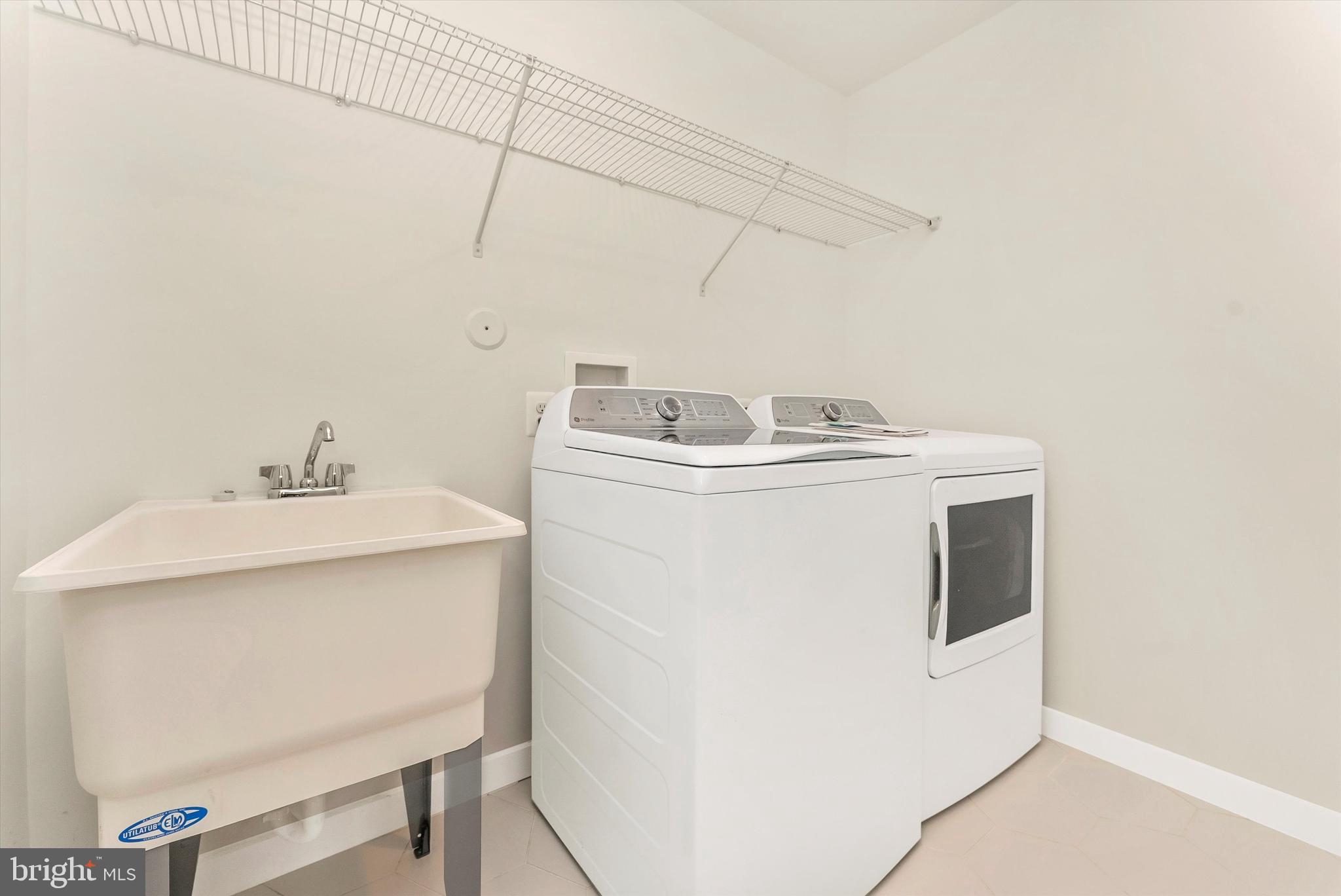 328 Madison Street Frederick, MD 21701 - Photo 31 of 49 a utility room with dryer and washer