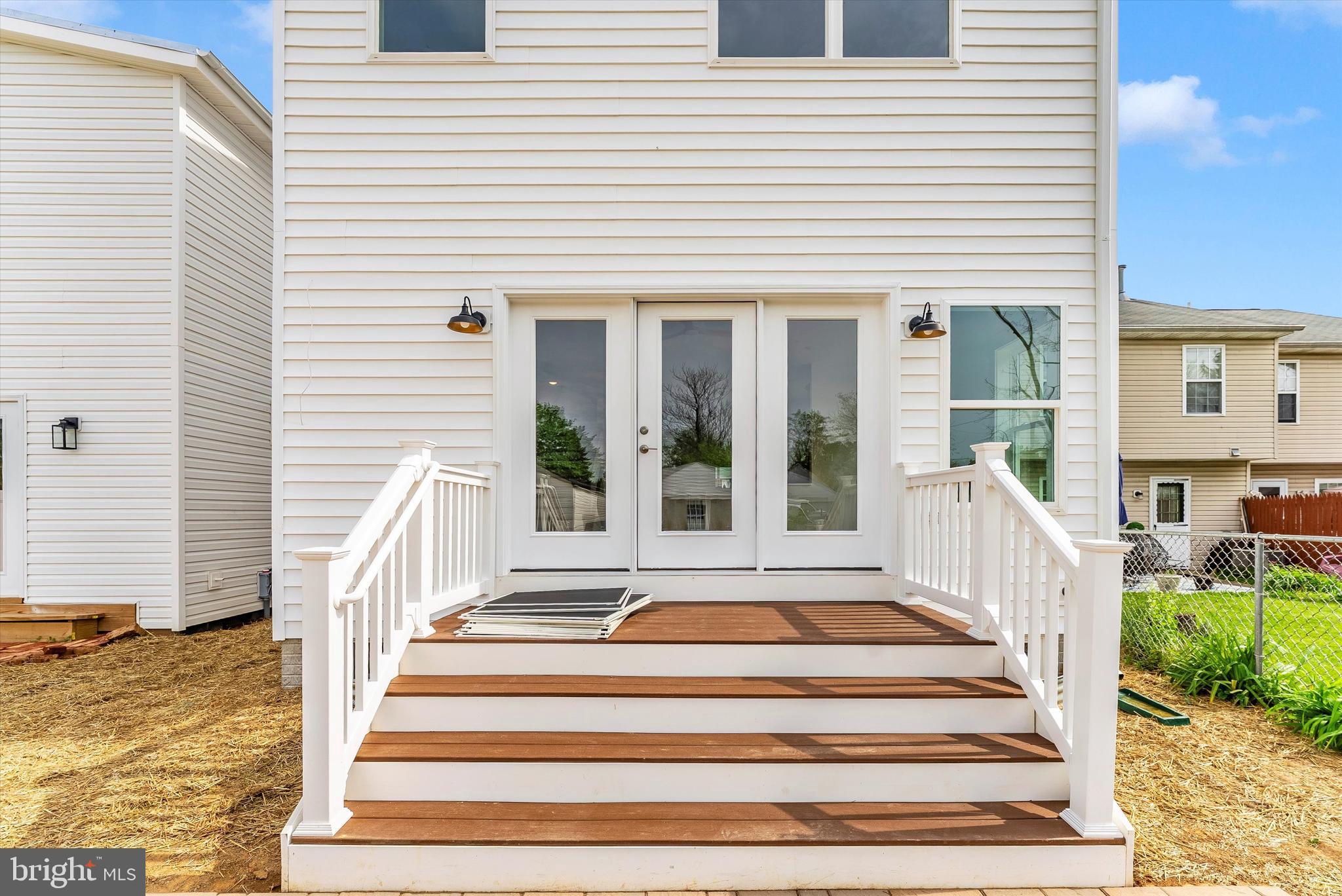 328 Madison Street Frederick, MD 21701 - Photo 42 of 49 a front view of a house with a small yard