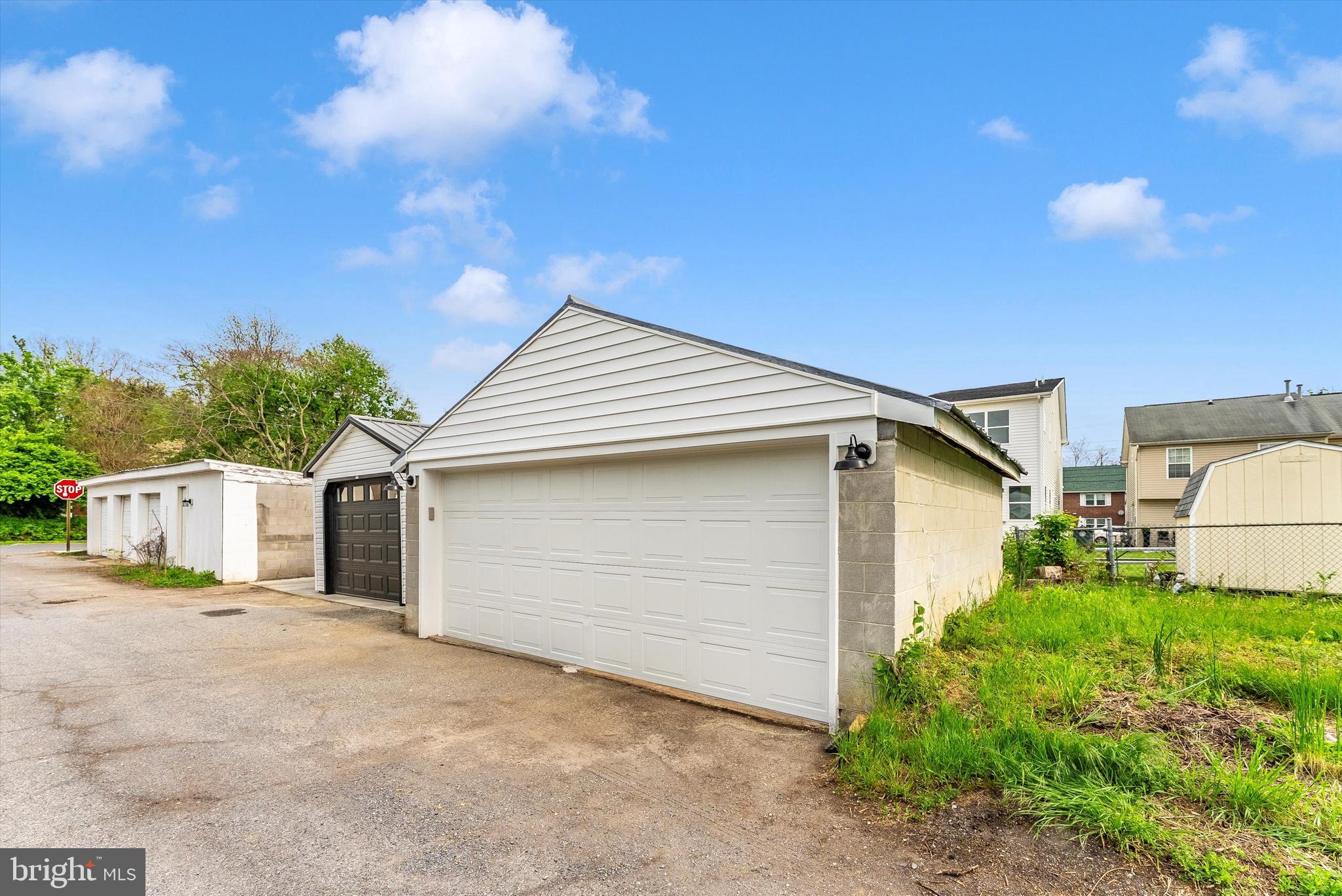 328 Madison Street Frederick, MD 21701 - Photo 48 of 49 a view of white house with large windows and a small yard