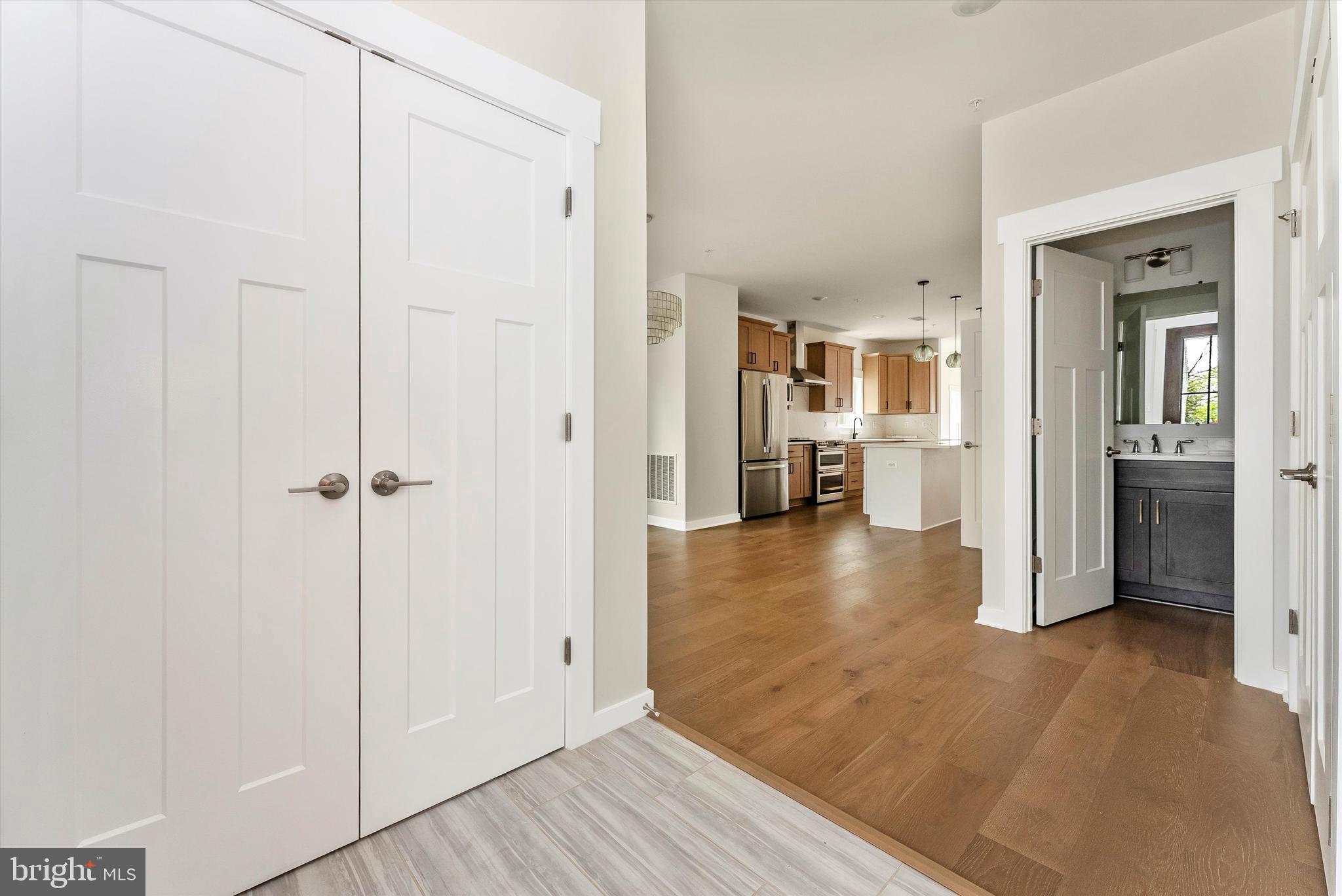 328 Madison Street Frederick, MD 21701 - Photo 5 of 49 a view of a hallway view with wooden floor and living room