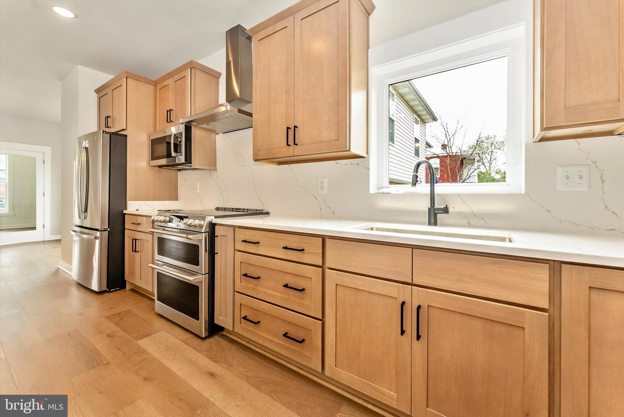 328 Madison Street Frederick, MD 21701 - Photo 9 of 49 a kitchen with cabinets appliances and a window