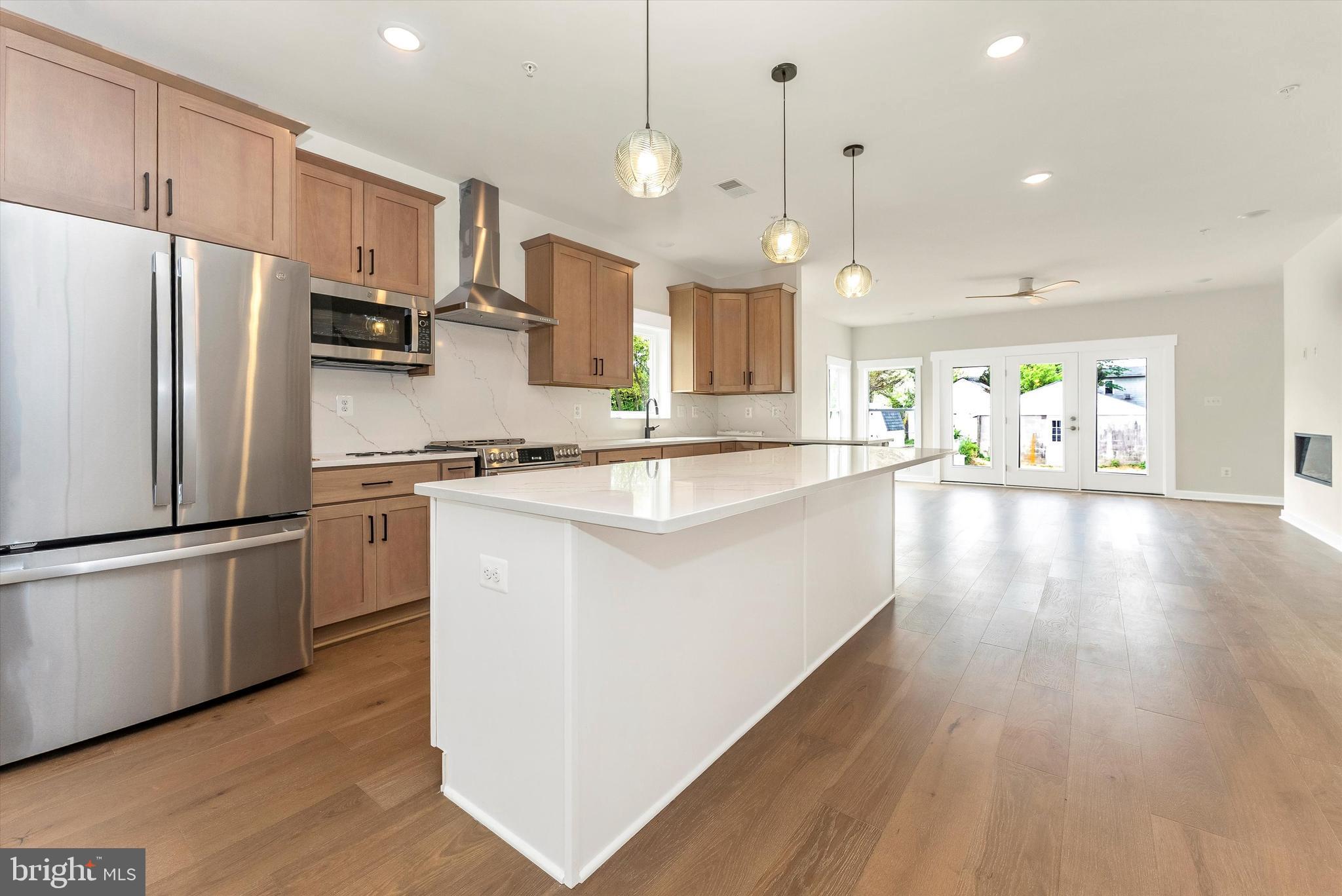 328 Madison Street Frederick, MD 21701 - Photo 10 of 49 a kitchen with stainless steel appliances a refrigerator and a sink