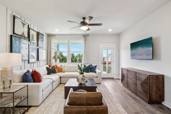 a living room with furniture and a large window