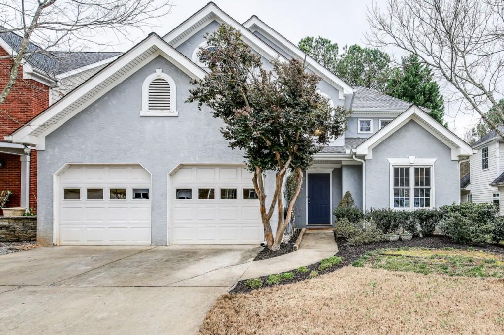 2821 Ashwood Place Decatur, GA 30030 - Photo 1 of 1 a view of a large white house with large windows and large trees