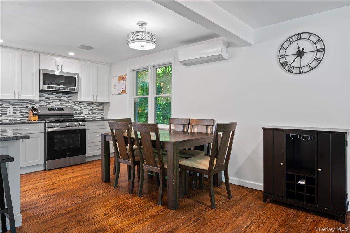 105 High St Extension Mount Kisco, NY 10549 - Photo 17 of 38 a view of a dining room with furniture window and wooden floor