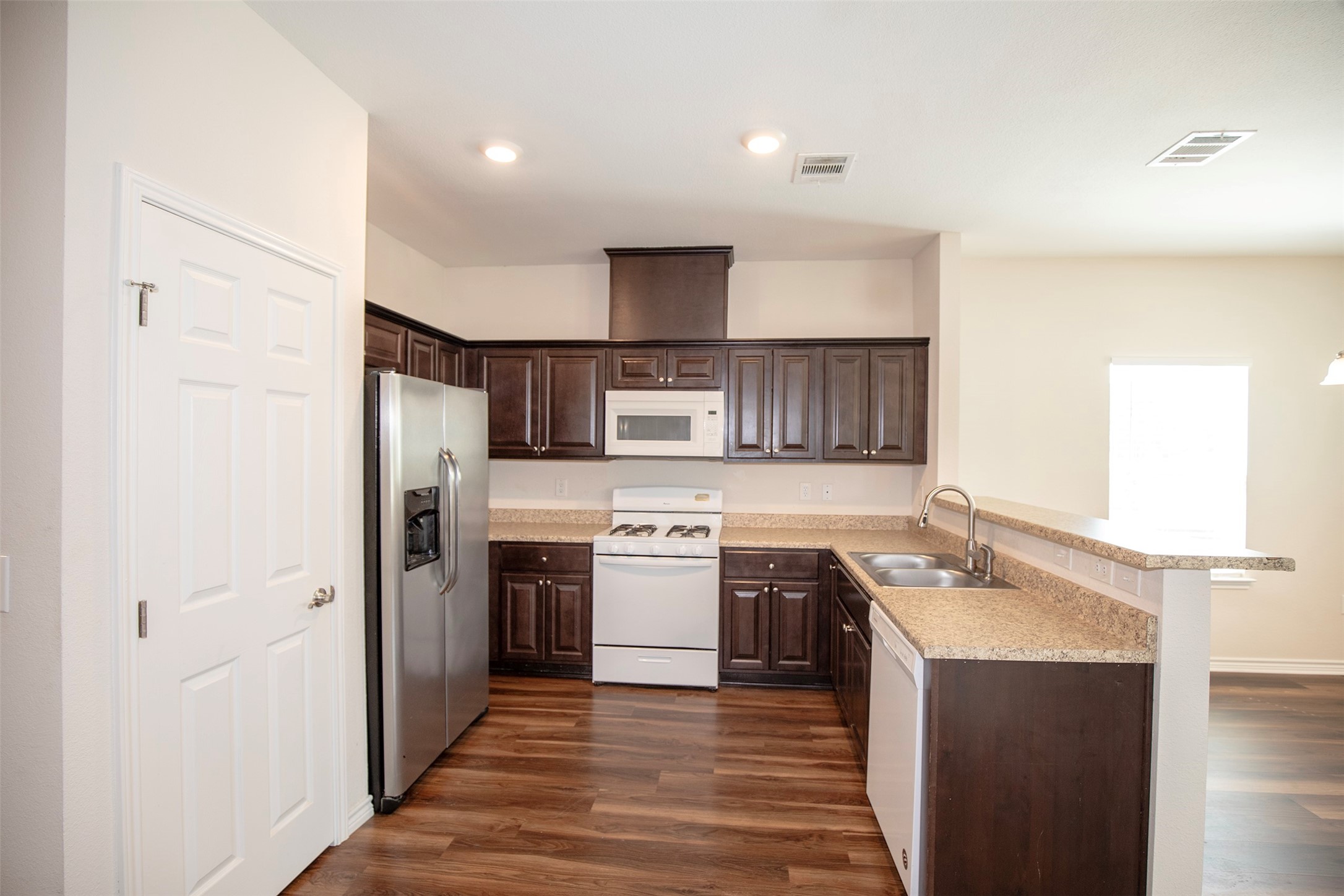 1125 Lake Road La Marque, TX 77568 - Photo 10 of 26 The kitchen features beautiful, dark cabinetry.