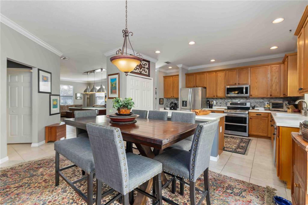 3907 62nd Terrace East Bradenton, FL 34203 - Photo 13 of 63 a view of a dining room with furniture window and wooden floor