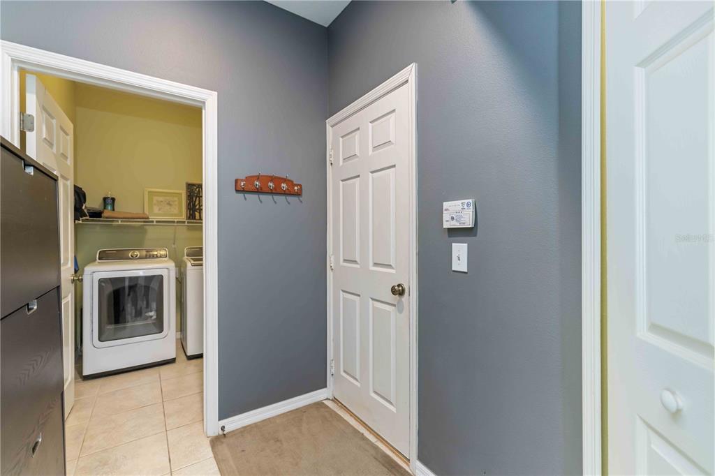 3907 62nd Terrace East Bradenton, FL 34203 - Photo 22 of 63 a kitchen with a refrigerator and washer