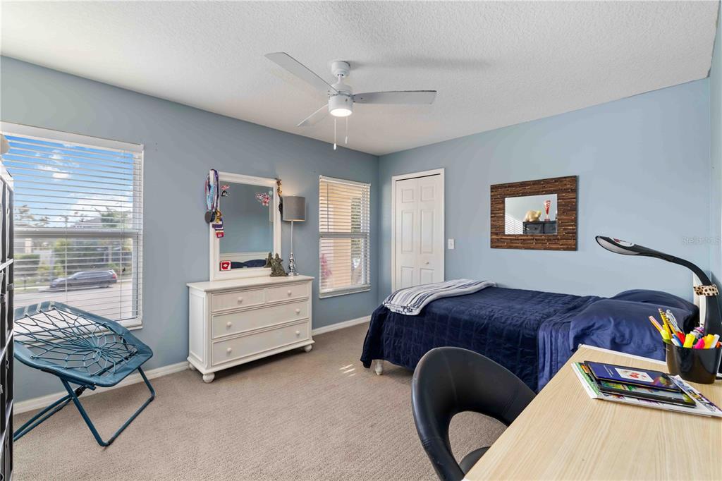 3907 62nd Terrace East Bradenton, FL 34203 - Photo 36 of 63 a bedroom with a bed and a lounge chair