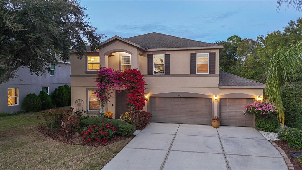 3907 62nd Terrace East Bradenton, FL 34203 - Photo 53 of 63 a front view of a house with a garden