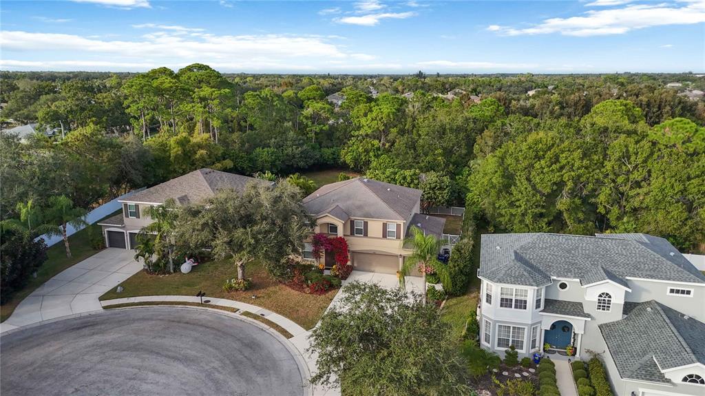 3907 62nd Terrace East Bradenton, FL 34203 - Photo 54 of 63 an aerial view of a house with garden space and street view