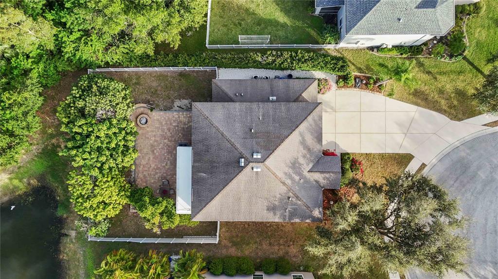 3907 62nd Terrace East Bradenton, FL 34203 - Photo 58 of 63 an aerial view of a house with a yard and a fountain