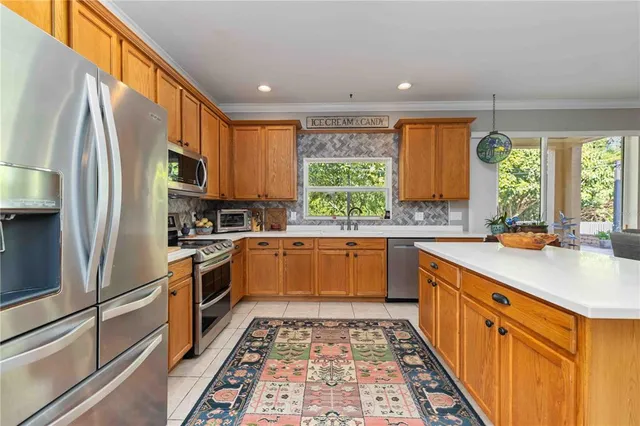 a kitchen with a refrigerator and washer