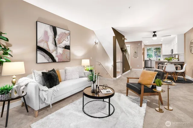 a living room with furniture a rug and a large window