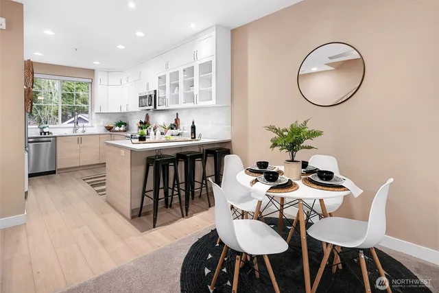 a dining room with furniture and window