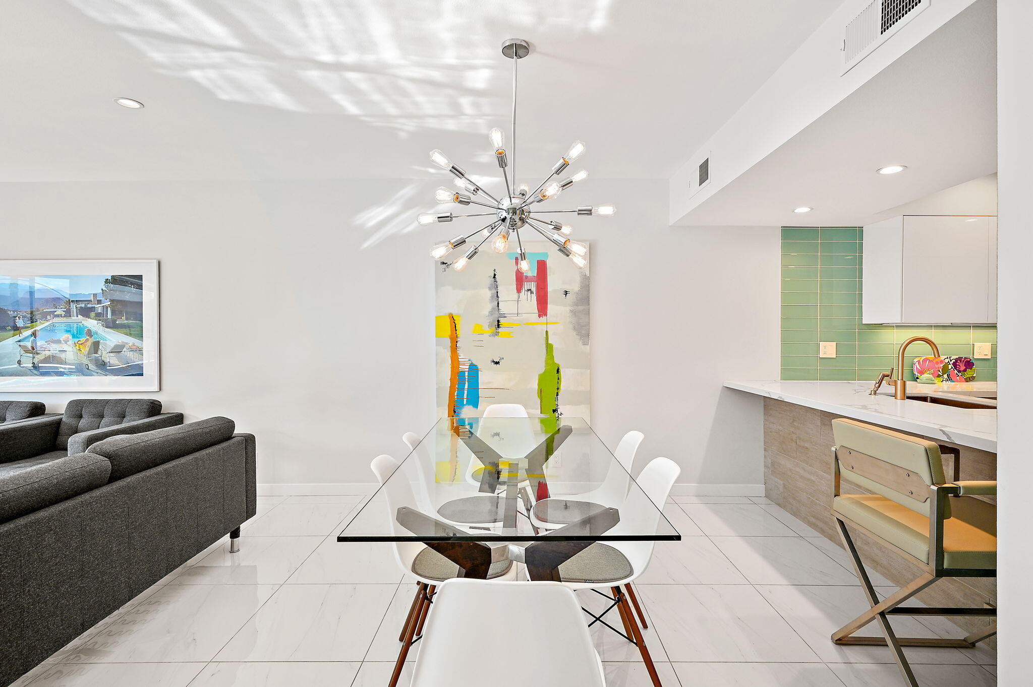 277 East Alejo Road, Unit 215 Palm Springs, CA 92262 - Photo 11 of 52 a living room with furniture and a chandelier