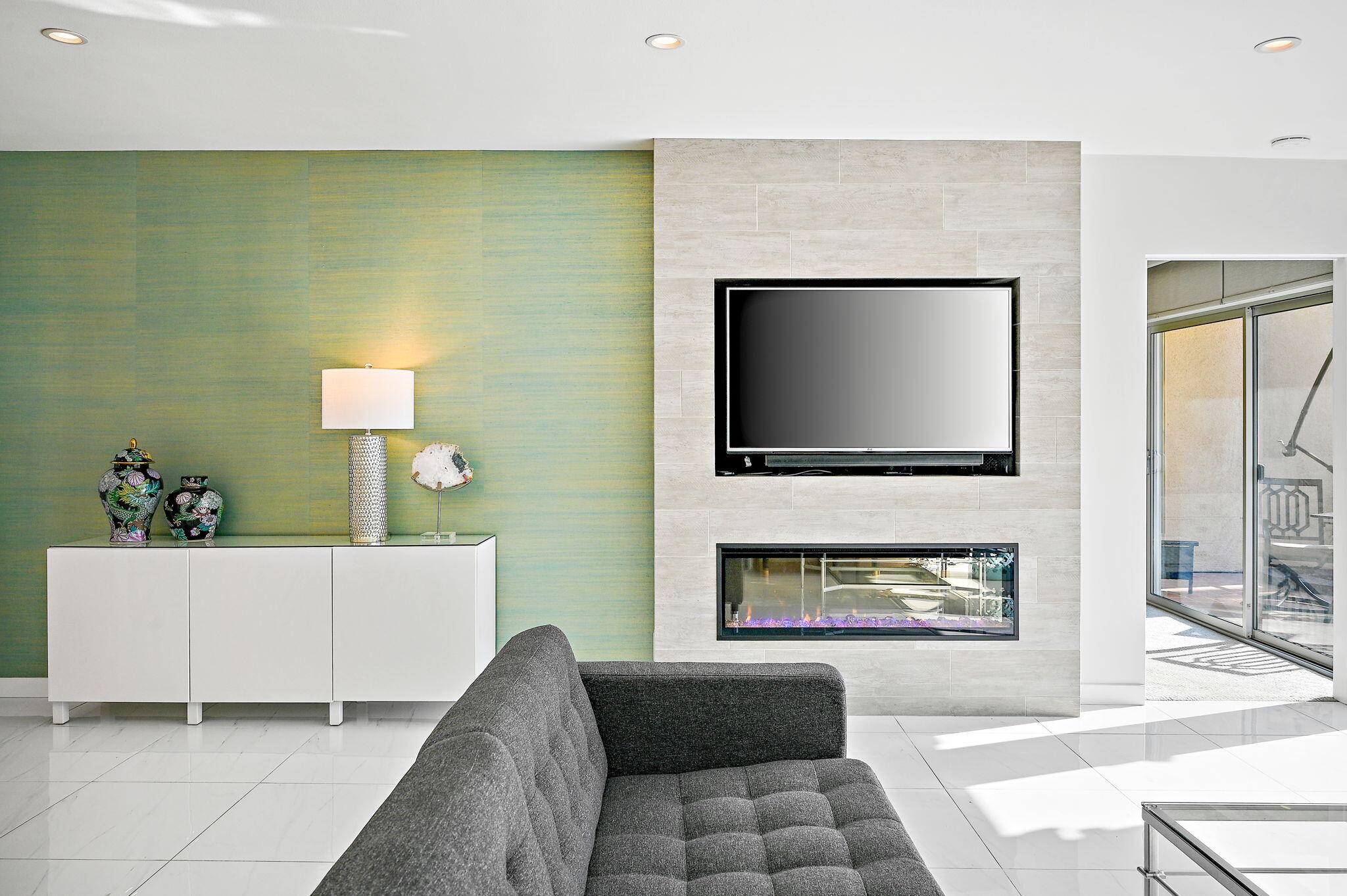 277 East Alejo Road, Unit 215 Palm Springs, CA 92262 - Photo 12 of 52 a living room with furniture and a flat screen tv