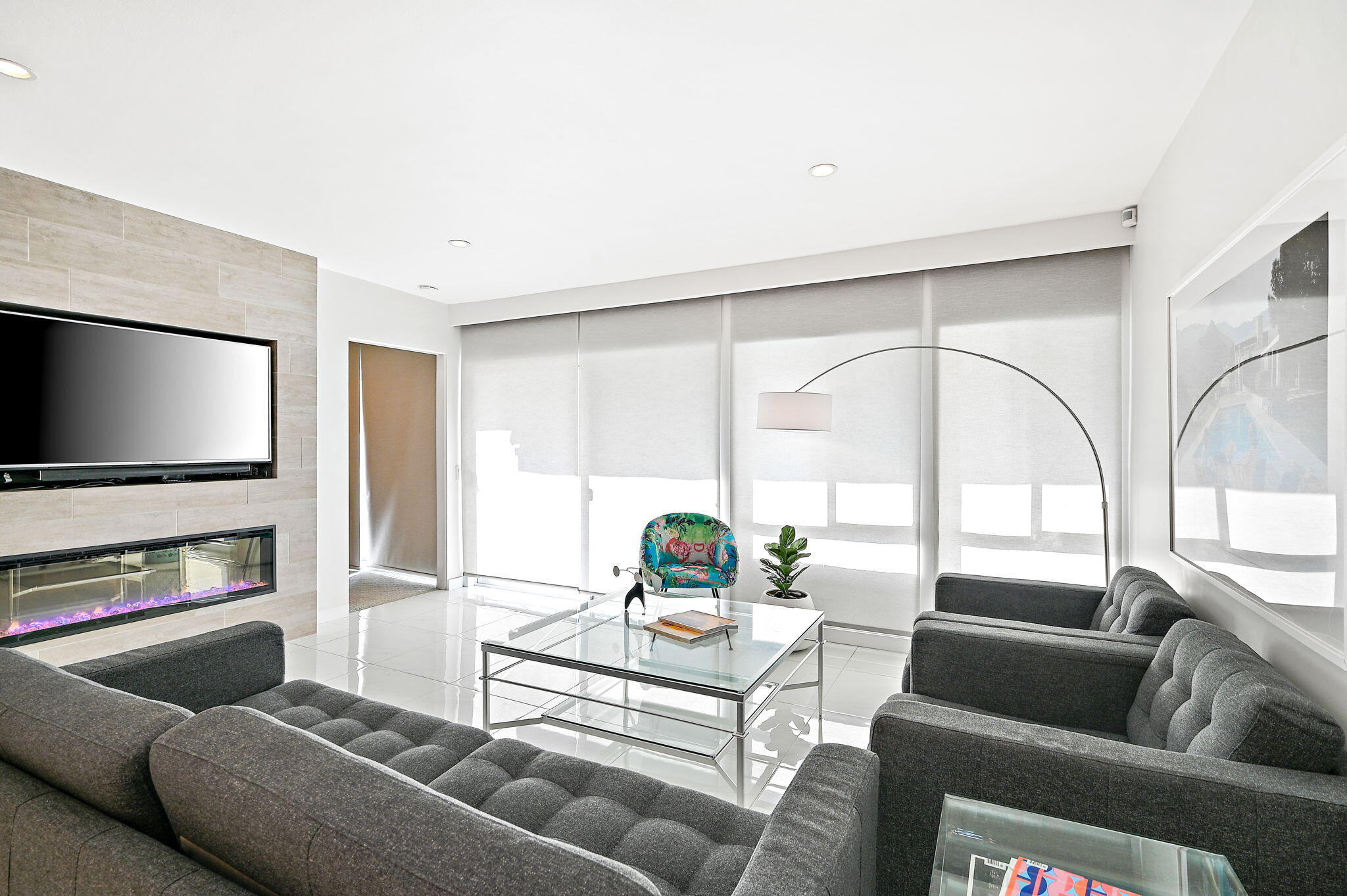 277 East Alejo Road, Unit 215 Palm Springs, CA 92262 - Photo 15 of 52 a living room with furniture and a flat screen tv