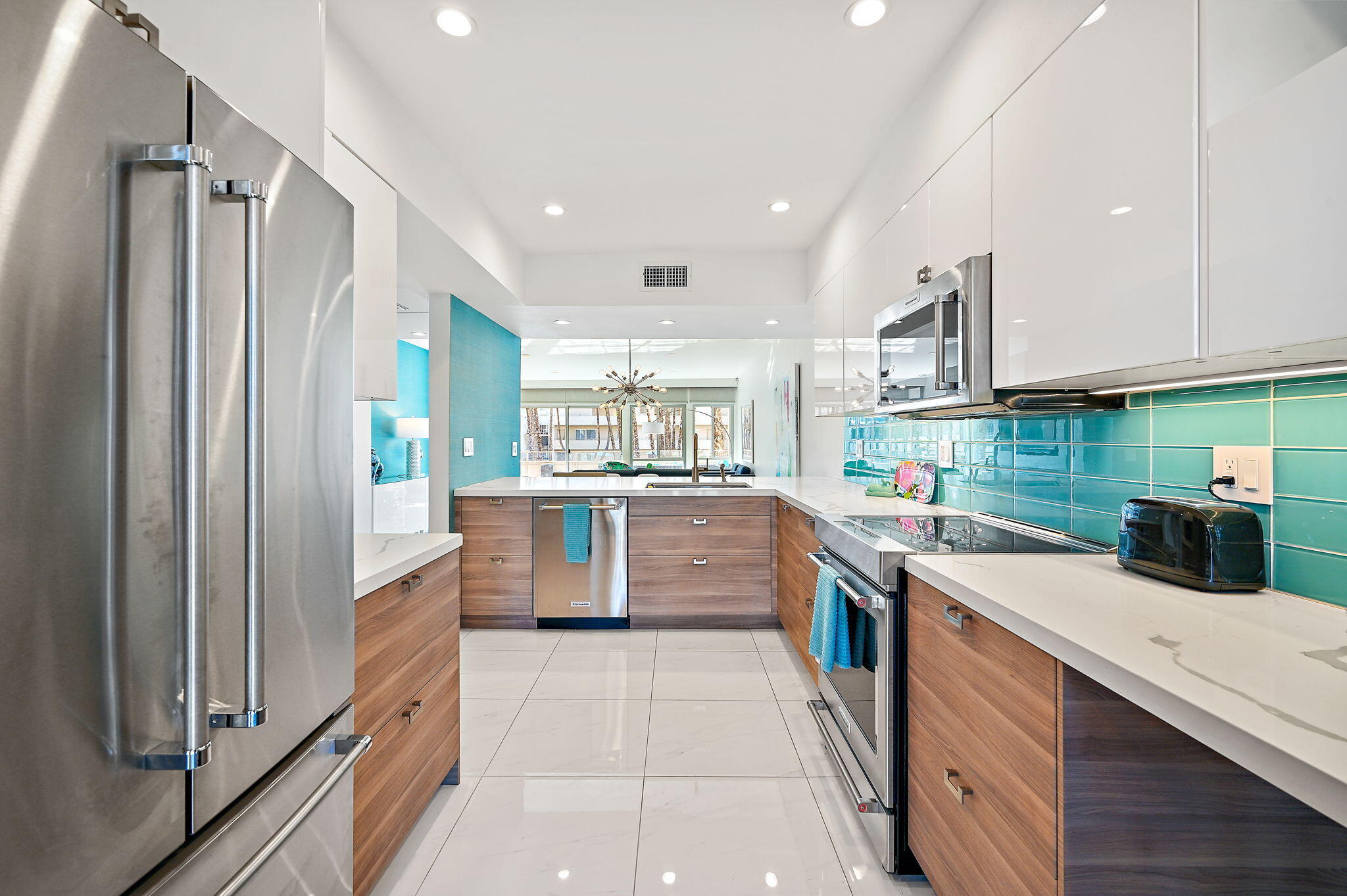 277 East Alejo Road, Unit 215 Palm Springs, CA 92262 - Photo 23 of 52 a kitchen with stainless steel appliances a sink counter top and stainless steel appliances