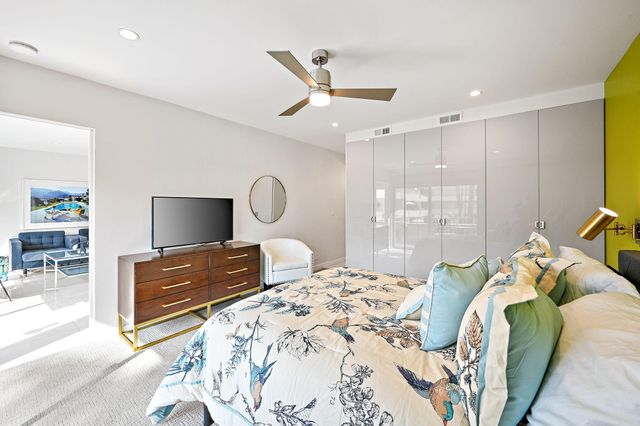 a bathroom with a sink mirror and vanity