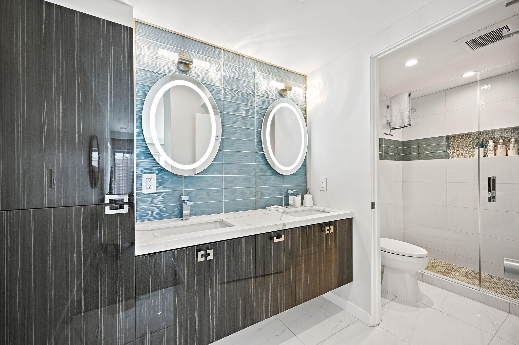 277 East Alejo Road, Unit 215 Palm Springs, CA 92262 - Photo 40 of 52 a bathroom with a double vanity sink mirror and toilet