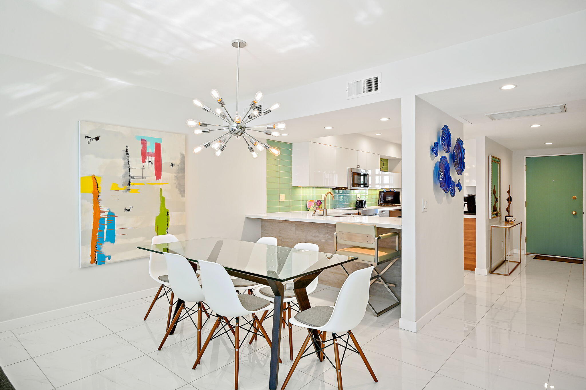 277 East Alejo Road, Unit 215 Palm Springs, CA 92262 - Photo 4 of 52 a view of a dining room with furniture and a kitchen