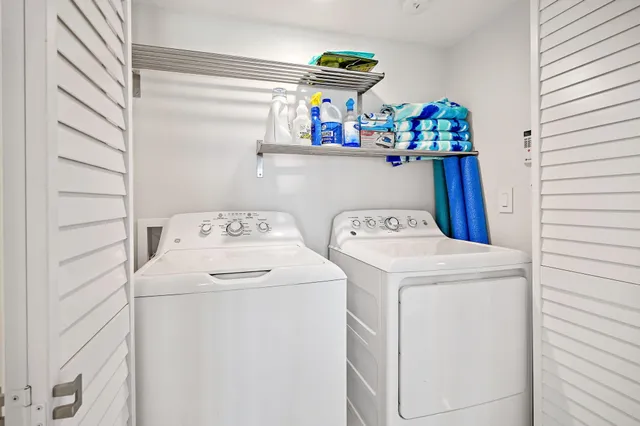 a bedroom with a bed a table and chair