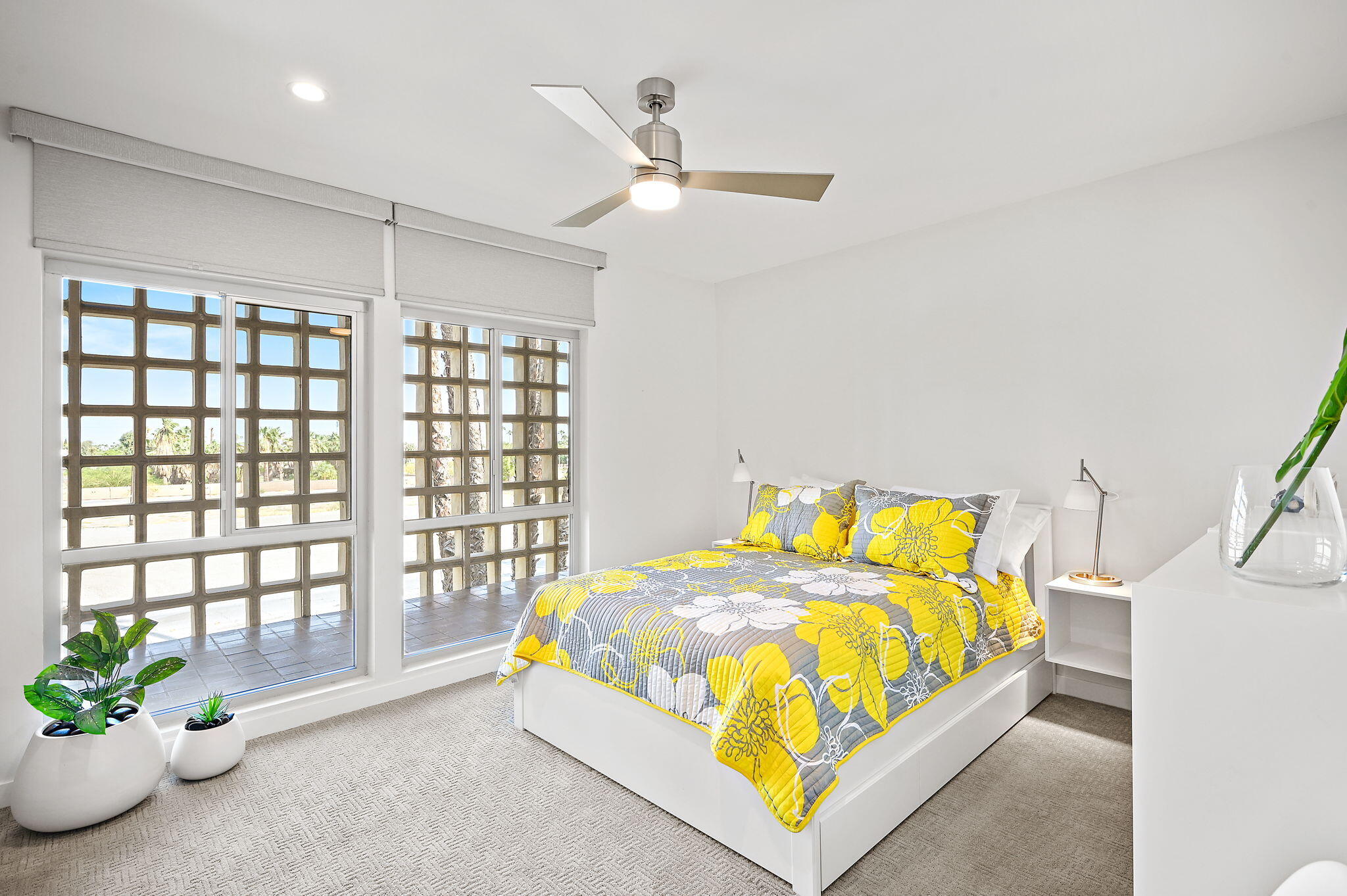 277 East Alejo Road, Unit 215 Palm Springs, CA 92262 - Photo 43 of 52 a bedroom with a bed and a window