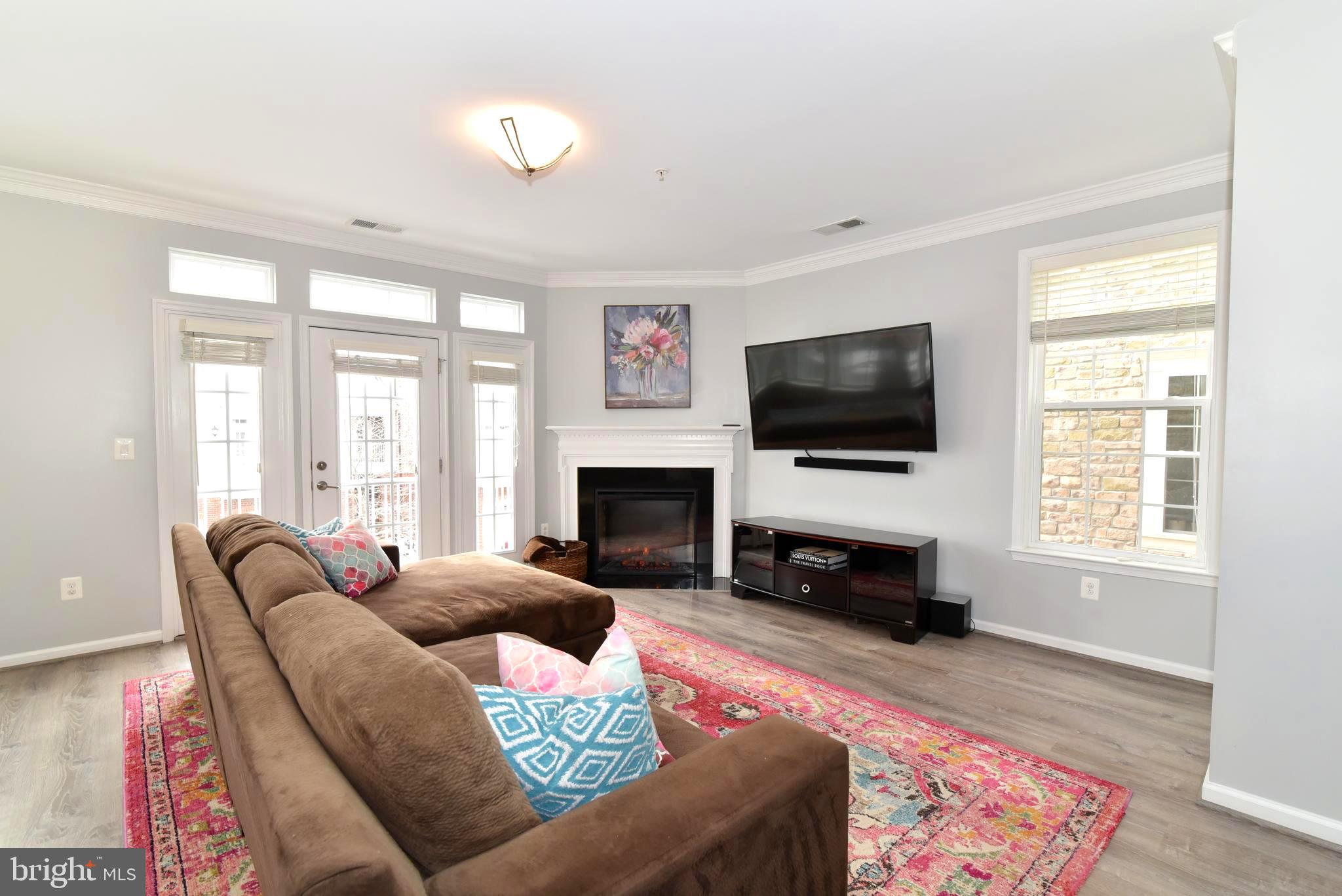 42594 Sunset Ridge Square, Unit 42594 Ashburn, VA 20148 - Photo 12 of 41 Your gas fireplace warms your living area