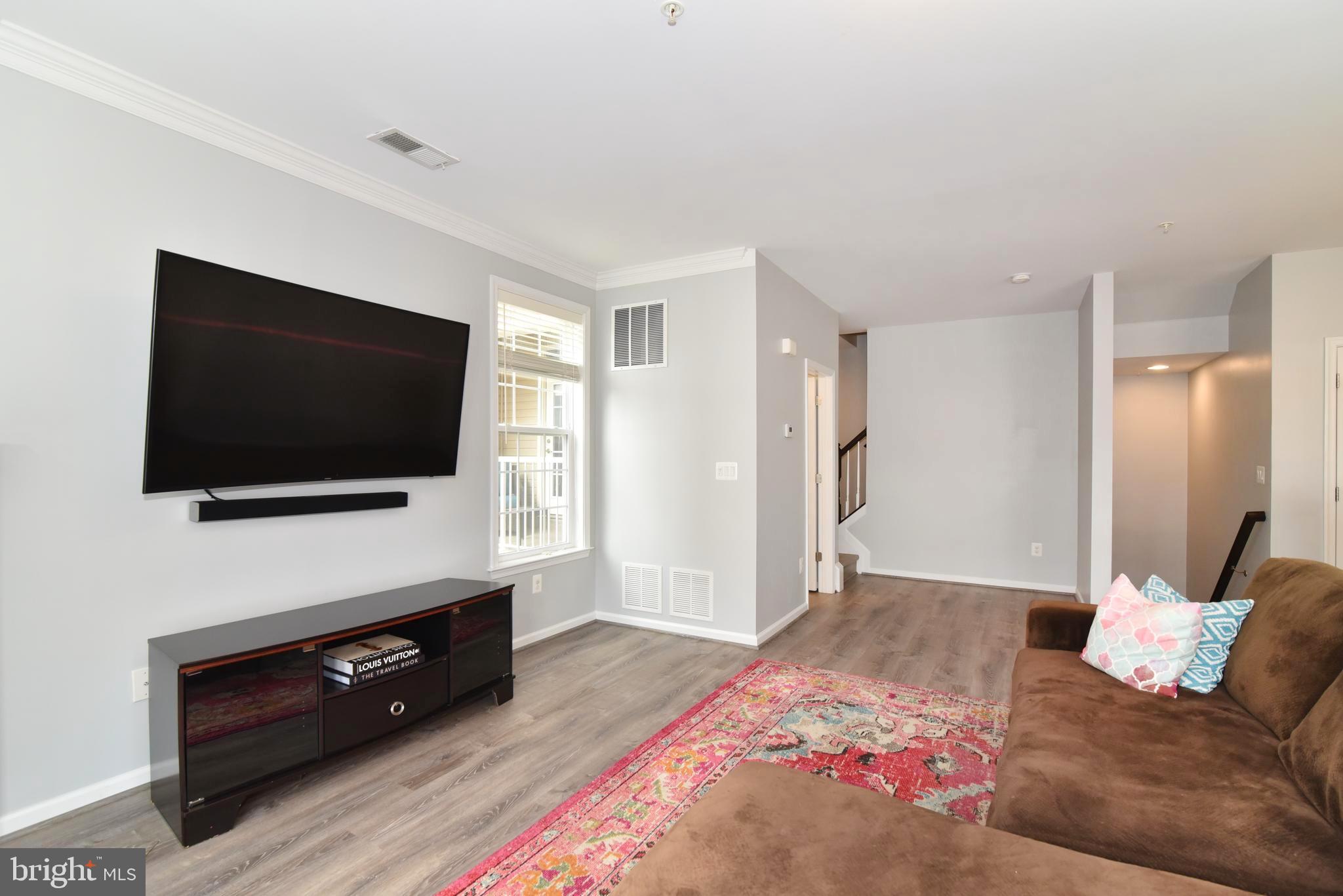 42594 Sunset Ridge Square, Unit 42594 Ashburn, VA 20148 - Photo 13 of 41 Your large living area will fit all your systems