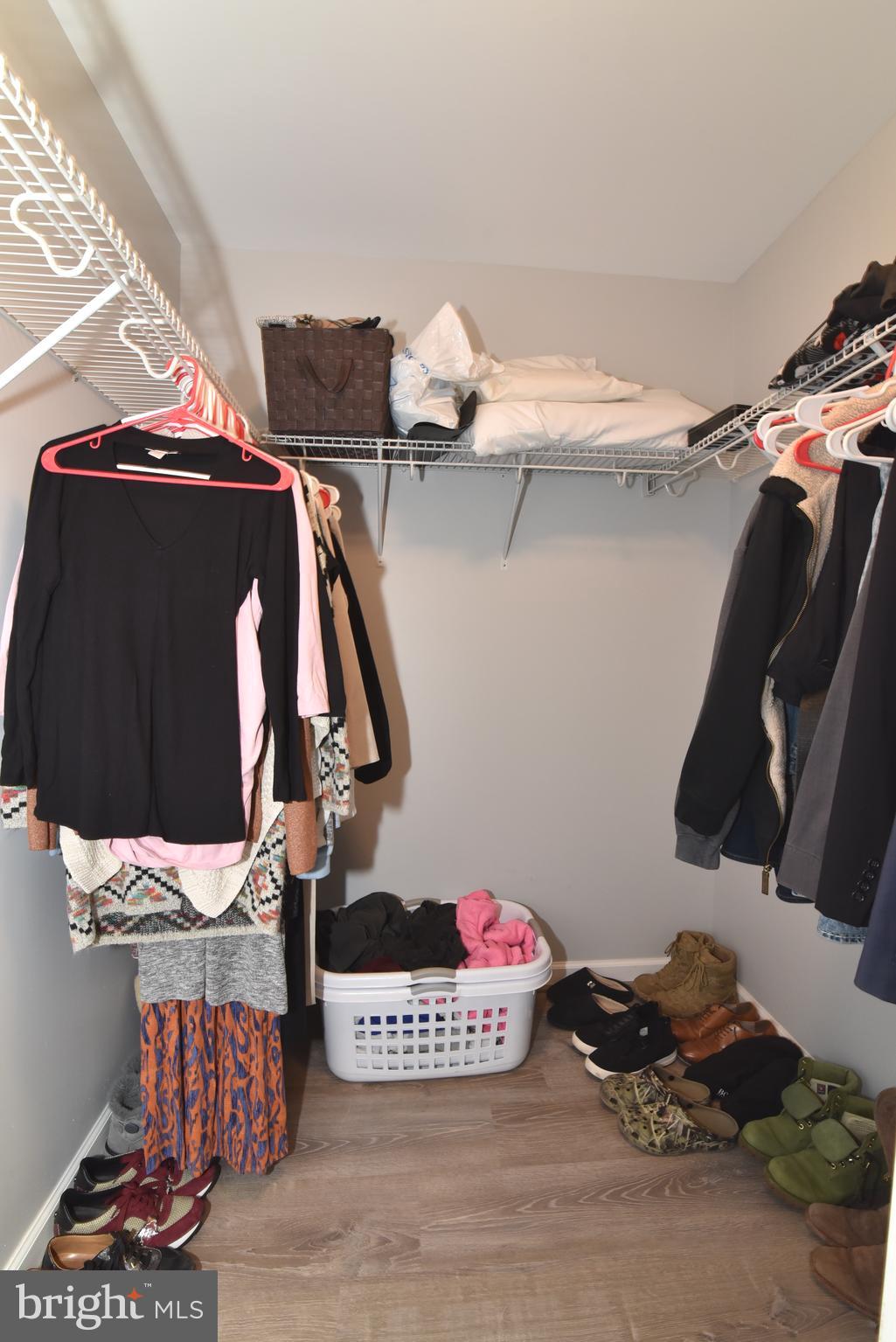 42594 Sunset Ridge Square, Unit 42594 Ashburn, VA 20148 - Photo 26 of 41 Large walk-in closet for all storage needs