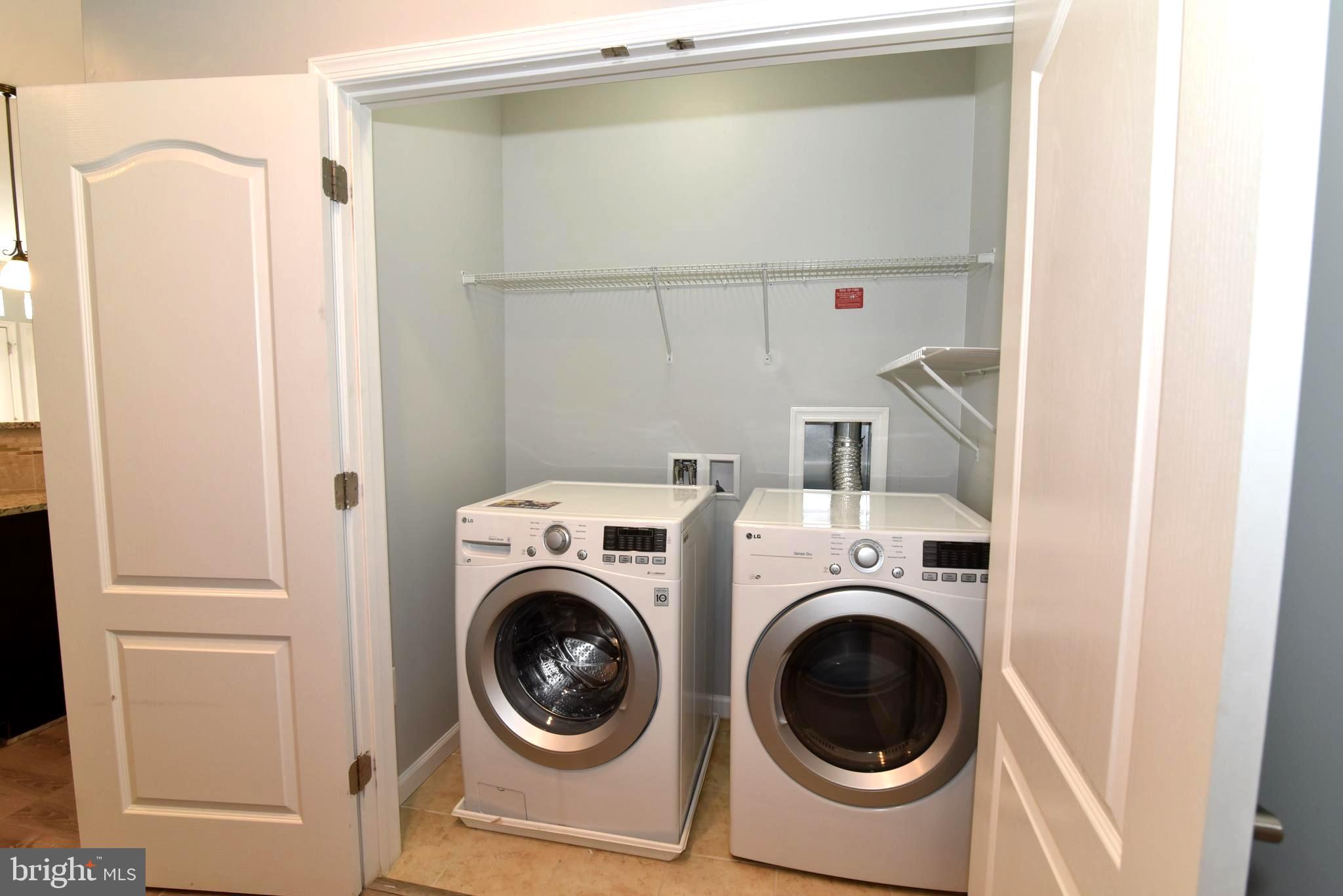 42594 Sunset Ridge Square, Unit 42594 Ashburn, VA 20148 - Photo 32 of 41 Main level washer/dryer with additional storage