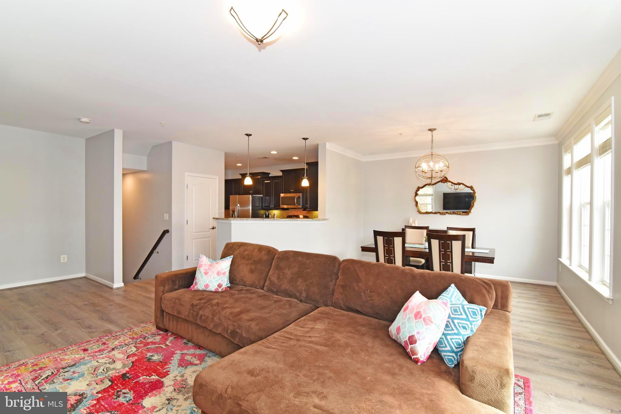 42594 Sunset Ridge Square, Unit 42594 Ashburn, VA 20148 - Photo 9 of 41 Your large living area easily connects your home