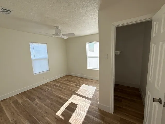 a view of an empty room and window