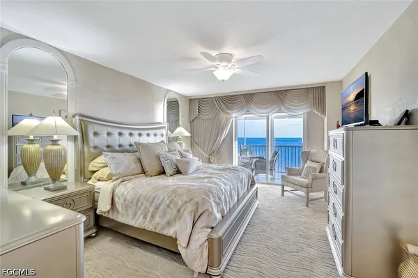 a bedroom with a bed and a mirror