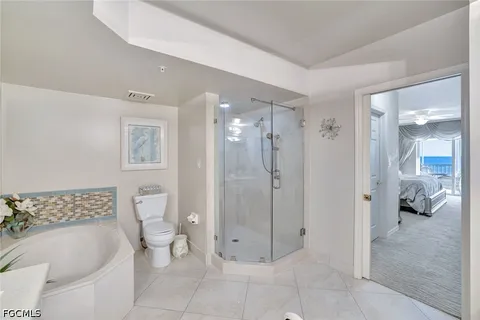 a bedroom with a bed and a table