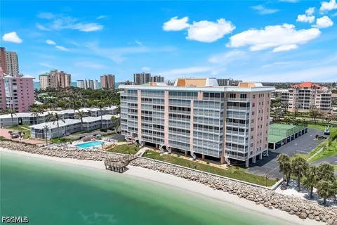 a view of a swimming pool with outdoor seating