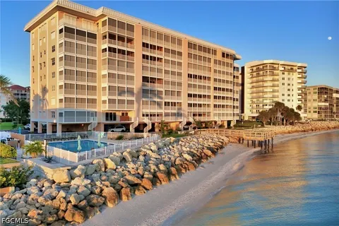 a front view of a building with a yard