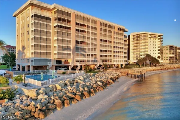 a front view of a building with a yard