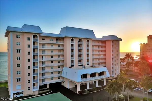 a view of a dining room with furniture wooden floor and chandelier
