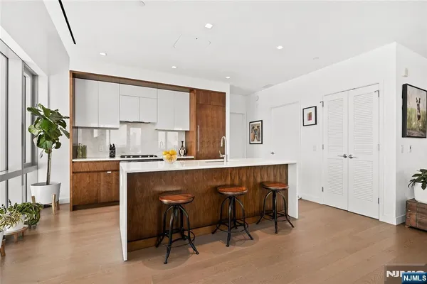 a kitchen with a table and chairs in it