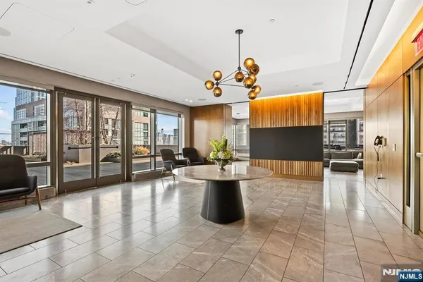 a lobby with furniture and rug