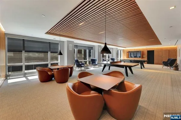 a living room filled with furniture and a table