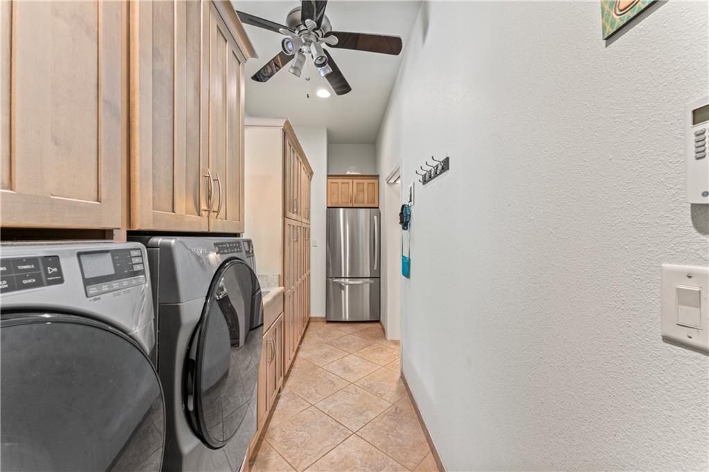 320 Holly Lane Walhalla, SC 29691 - Photo 30 of 41 This functional laundry area features efficient appliances and ample cabinetry, offering practical daily living.
