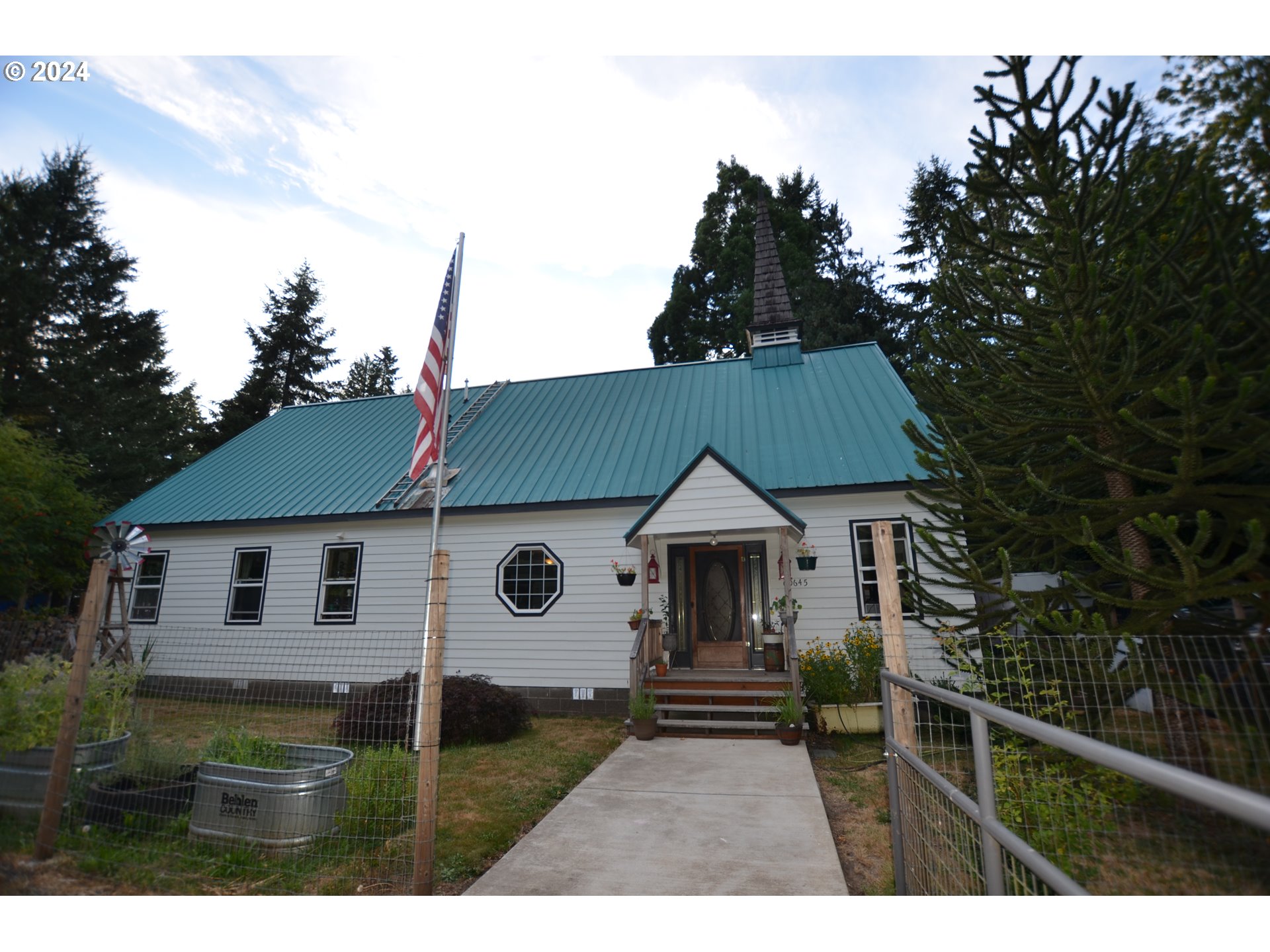 a aerial view of a house with a yard