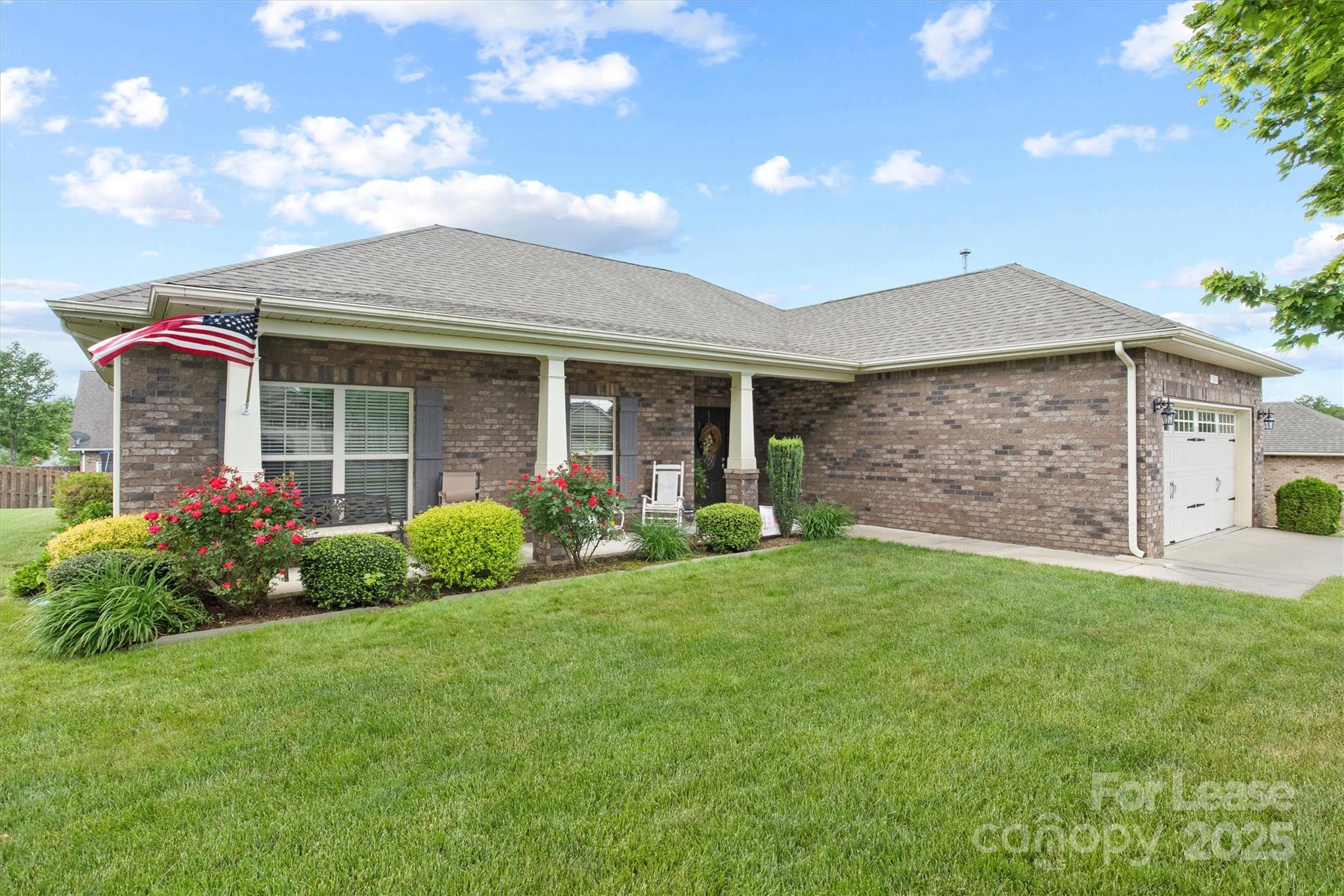 7266 Kenyon Drive Denver, NC 28037 - Photo 1 of 25 a front view of a house with garden