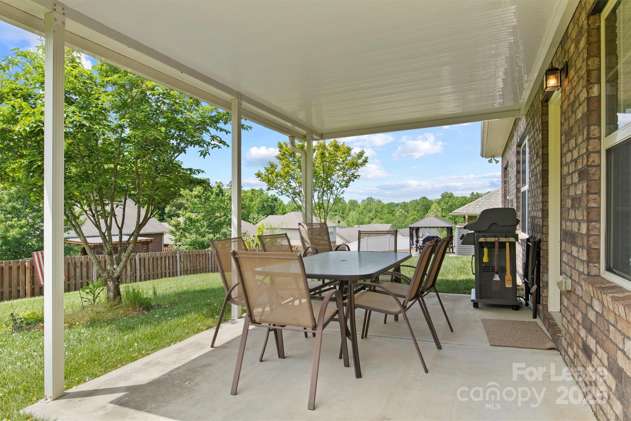 7266 Kenyon Drive Denver, NC 28037 - Photo 22 of 25 a view of an outdoor dining space with a table and chairs