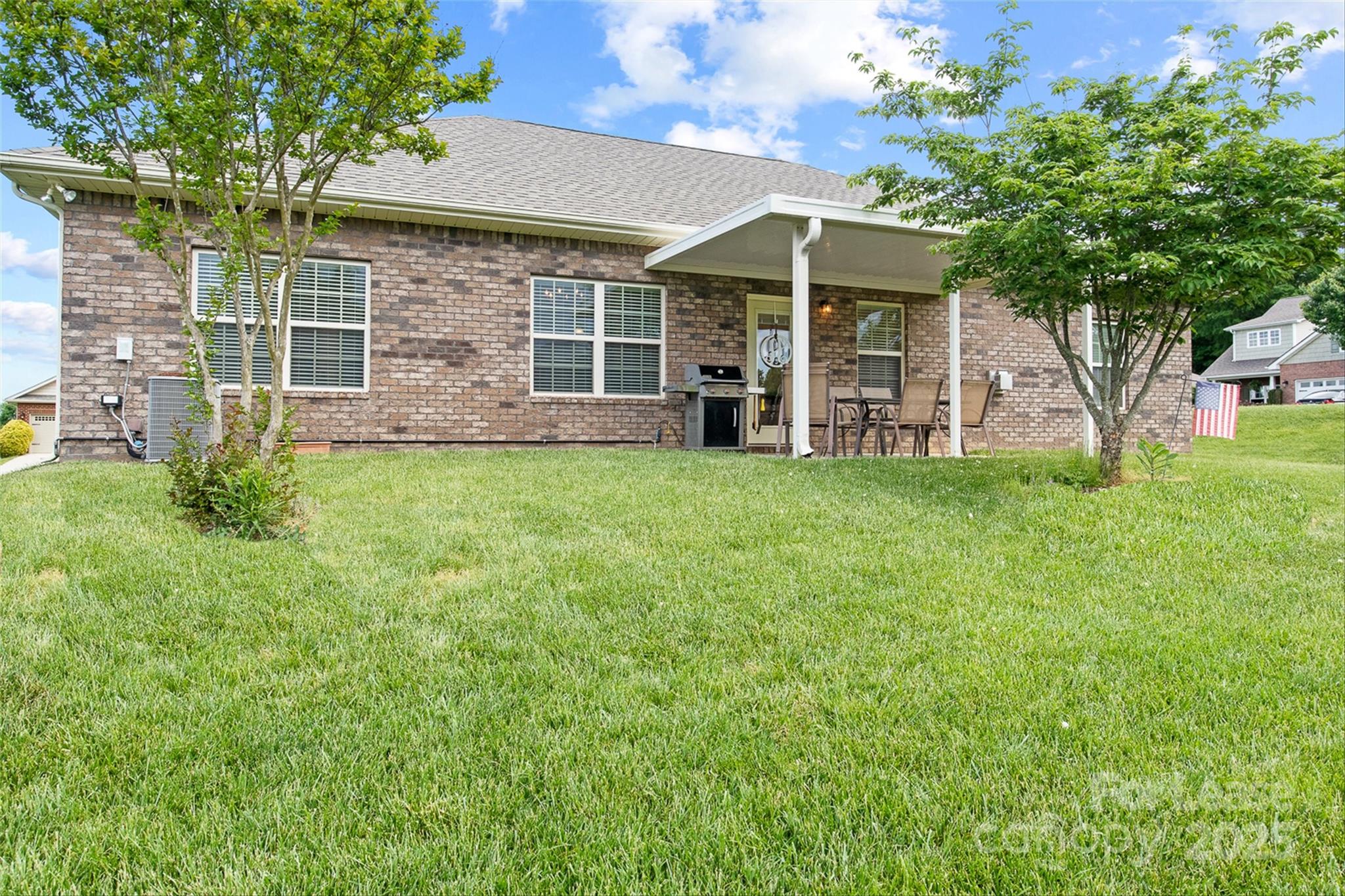 7266 Kenyon Drive Denver, NC 28037 - Photo 23 of 25 a view of a house with a yard